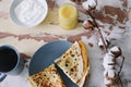 Stack of delicious homemade pancakes on plate with honey, sour cream and tea. Breakfast. Rustic style, close up top view. Flat lay Royalty Free Stock Photo