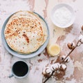 Stack of delicious homemade pancakes on plate with honey, sour cream and tea. Breakfast. Rustic style, close up top view. Flat lay Royalty Free Stock Photo