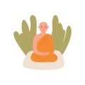 Cute Peaceful Buddhist Theravada Thai Monk in yellow robe meditating in lotus posture with closed eyes. Tropical plants