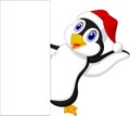 Cute penguin cartoon with red hat waving Royalty Free Stock Photo