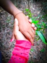 A boy holding a girl`s hand