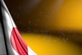 Cute picture of Japan flag hanging diagonal on yellow with selective focus and empty space for text - any feast flag 3d