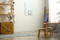 Cute picture on white wall and wooden furniture. Children`s room interior design