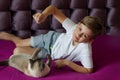 Portrait of a young blonde boy with his cat. Lovelly cat . Friends Toghever to play Royalty Free Stock Photo