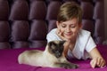 Portrait of a young blonde boy with his cat. Lovelly cat . Friends Toghever to play Royalty Free Stock Photo