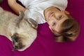 Portrait of a young blonde boy with his cat. Lovelly cat . Friends Toghever to play Royalty Free Stock Photo