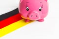 cute pig money box and Germany flag - save money in Germany concept Royalty Free Stock Photo