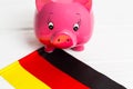 cute pig money box and Germany flag - save money in Germany concept. Closedup Royalty Free Stock Photo