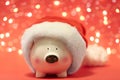 Cute piggy bank with Santa hat Royalty Free Stock Photo