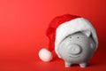 Cute piggy bank with Santa hat Royalty Free Stock Photo