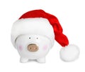 Cute piggy bank with Santa hat Royalty Free Stock Photo