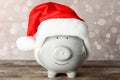 Cute piggy bank with Santa hat Royalty Free Stock Photo