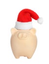 Cute piggy bank with Santa hat Royalty Free Stock Photo