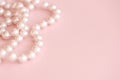 Cute pink background with pearls bead.