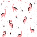 Cute pink dinosaurs seamless vector pattern with dots, crown, flower. Cool kid nursery print design in scandinavian