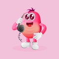 Cute pink monster pick up the phone, answering phone calls