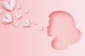 Cute Pink pastel female silhouette. Women Face profile in paper cut style. Portrait. Air kiss with Origami Love Hearts