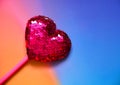 Cute , pink , sequin , shining heart shape gift on valentine day on colorful and vivid color background