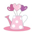 A cute pink vase in the form of a watering can, with a pattern with white polka dots, with a bouquet of three hearts