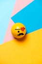 Cute pirate and eye patch and mustache - emoticon, emoji - on a modern colorful geometric background