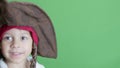 Cute pirate preschool boy making angry face and slicing camera with his cutlass