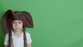 Cute pirate preschool boy making sad face and slicing camera with his cutlass.