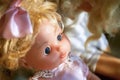 Cute plastic doll with bow. Close up