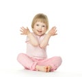 Cute playful baby girl sitting on the floor Royalty Free Stock Photo