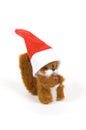 Cute plushy squirrel wearing a christmas hat Royalty Free Stock Photo