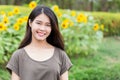 Cute portrait asian Thai teen smile with sunflower Royalty Free Stock Photo