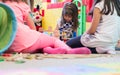 Cute girl building a structure from toy blocks during playtime Royalty Free Stock Photo