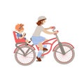 Cute pre-teen or teenager girl riding a bicycle with little girl on back Child Bike Seat, Baby Carrier Seat. Two Girls