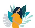 Cute pregnant woman on a background of blue leaves