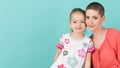 Cute preschool age girl with her mother, young cancer patient in remission. Cancer patient and family support.