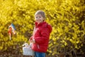 Cute preschool child, boy, holding handmade braided whip made from pussy willow, traditional symbol of Czech Easter used for