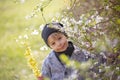 Cute preschool child, boy, holding handmade braided whip made from pussy willow, traditional symbol of Czech Easter used for