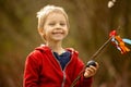 Cute preschool child, boy, holding handmade braided whip made from pussy willow, traditional symbol of Czech Easter used for