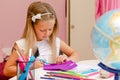 Cute preschool girl is doing her creative homework. Education Royalty Free Stock Photo