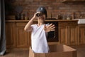 Cute preteen girl play at kitchen imagine herself a pirate Royalty Free Stock Photo