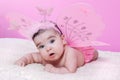 Cute, pretty, happy, chubby and baby girl, with pink butterfly wings Royalty Free Stock Photo