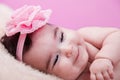Cute, pretty, happy, chubby baby girl portrait with a big naughty smile. or on fluffy blanket. Royalty Free Stock Photo