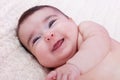 Cute, pretty, happy, chubby and smiling baby girl portrait, laughing with a big smile. Royalty Free Stock Photo