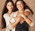 Cute pretty teen daughter with mature mother