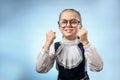 Cute Primary Schoolgirl Make Fist Blue Background Royalty Free Stock Photo