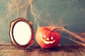 Cute pumpkin next to blank photo frame Royalty Free Stock Photo