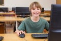 Cute pupil in computer class Royalty Free Stock Photo