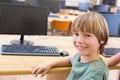 Cute pupil in computer class