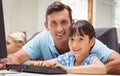 Cute pupil in computer class with teacher