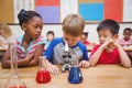 Cute pupil looking through microscope Royalty Free Stock Photo