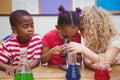 Cute pupil looking through microscope Royalty Free Stock Photo